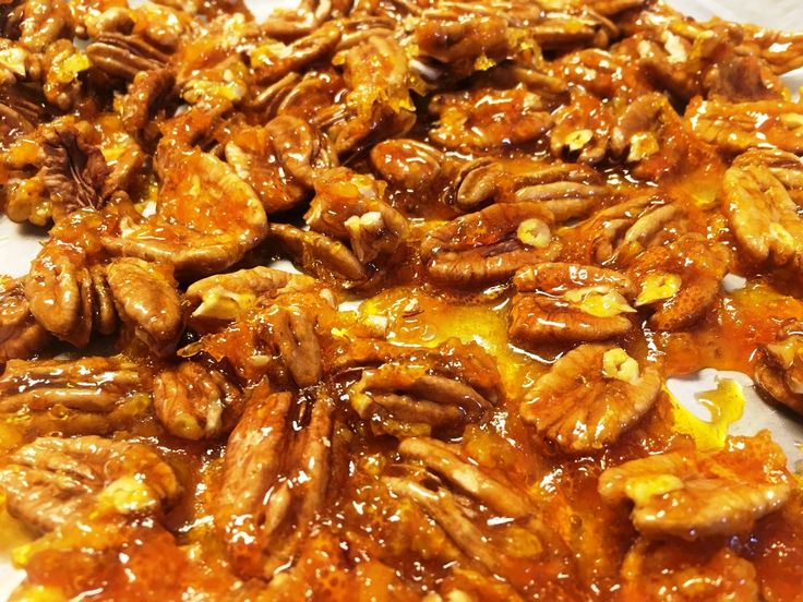 pecans in sauce on a white plate