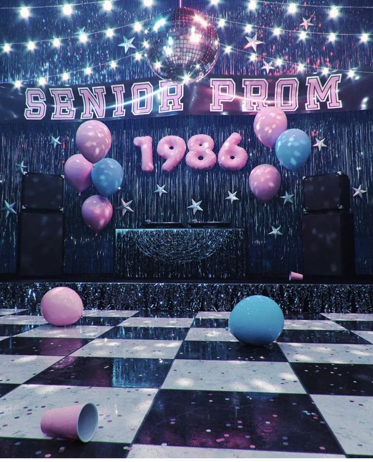 balloons and streamers are floating in the air on a checkerboard dance floor