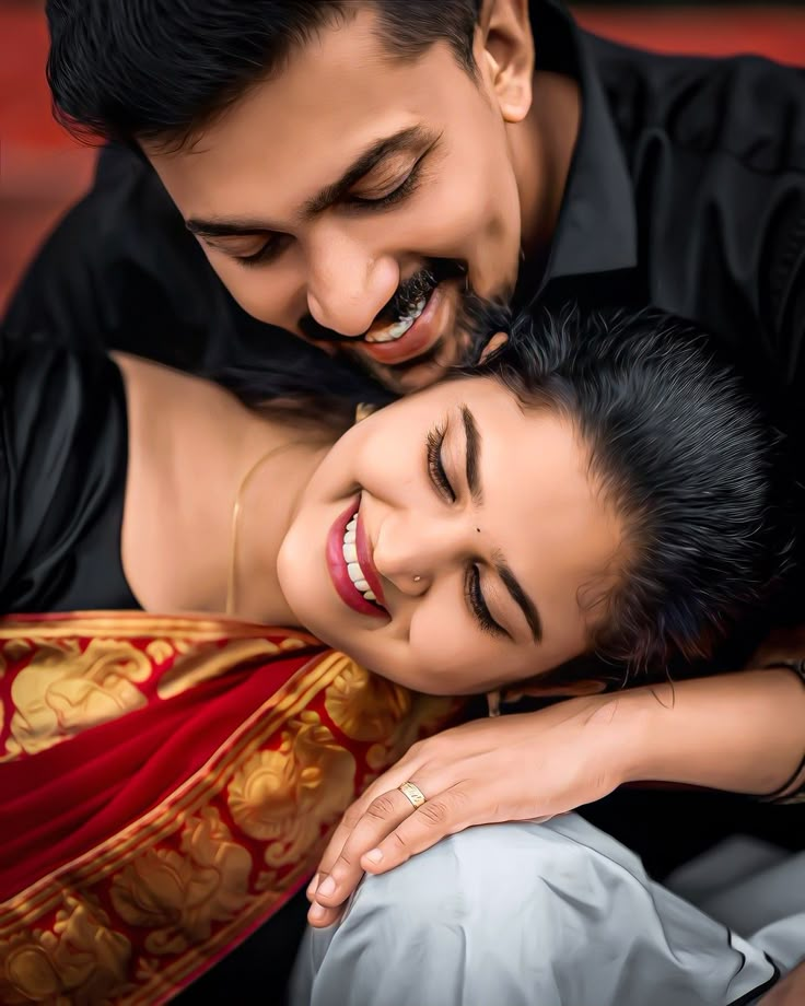 a man and woman are cuddling together in this artistic photo taken by the photographer