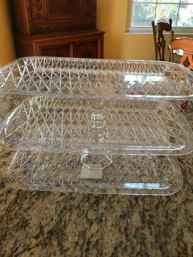 two clear dishes sitting on top of a counter