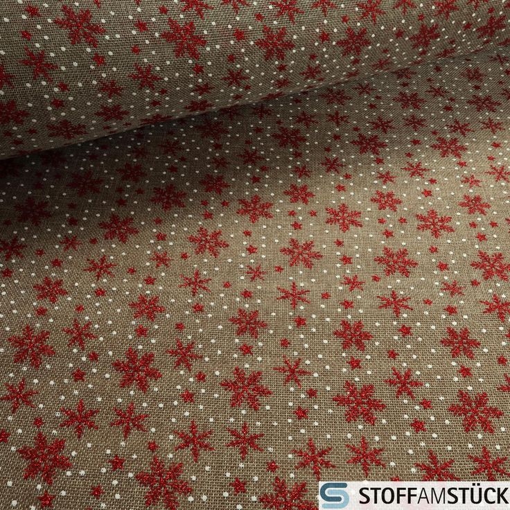 fabric with red snowflakes on it