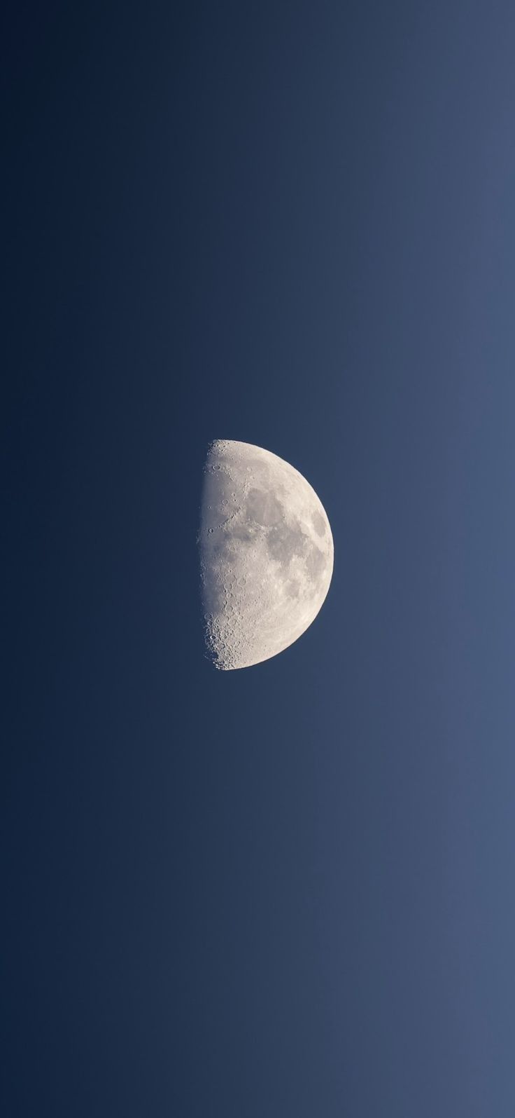 the moon is in the blue sky with no clouds