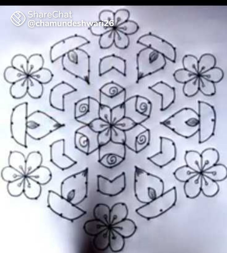 a drawing of an intricate flower design on a sheet of white paper with black ink