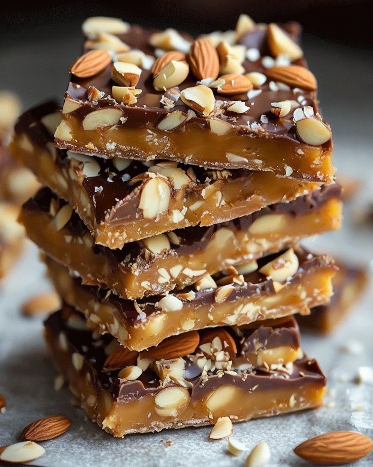 Indulge in crunchy Almond Toffee Bites, perfect for a sweet treat! Easy to make with buttery toffee and roasted almonds. #Dessert #SweetSnacks #Almond #EasyRecipes #Toffee Almond Toffee Bars, Almond Toffee Recipe, Chocolate Almond Toffee, Almond Bark Recipes, Toffee Bites, Walnut Cookie Recipes, Soft Toffee, Holiday Treats Recipes, Almond Toffee