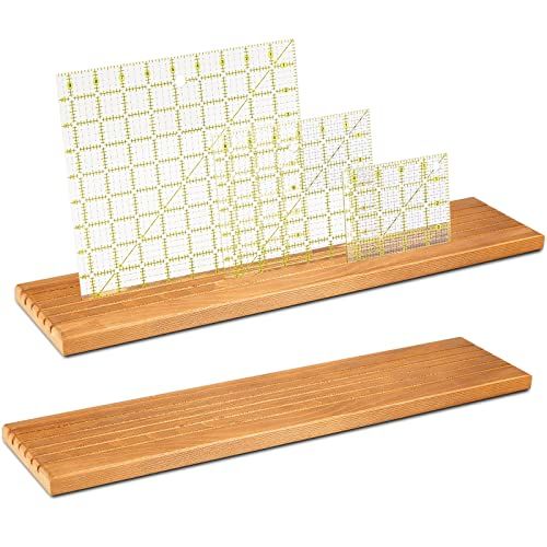 two wooden shelfs with white and yellow squares on them, one has a cut out piece of paper in front of the other