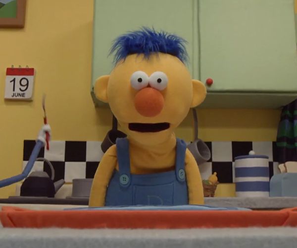 an image of a cartoon character in the bathroom with blue hair and overalls on