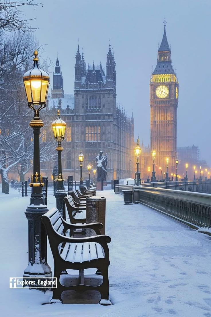 benches are covered with snow in front of big ben and the palace of westminster, london