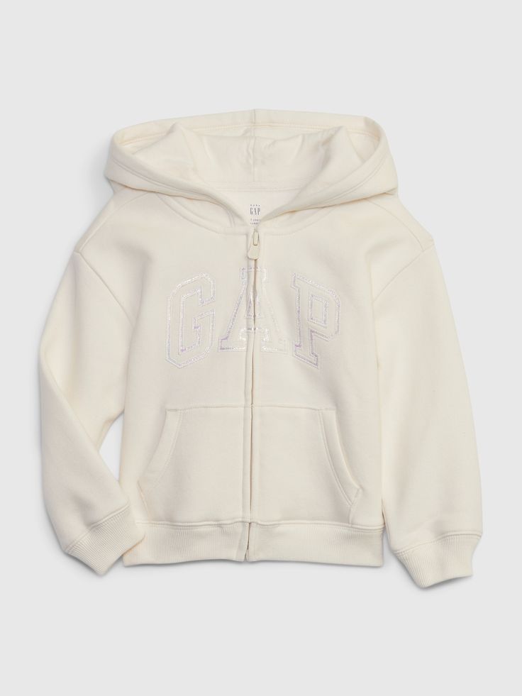 Soft knit cotton-blend hoodie.  Hooded neckline.  Long sleeves with banded cuffs.  Zipper front.  Metallic Gap logo at front.  Front kanga pockets.  Straight, easy fit.  Hits at the hip. Beige Hoodies, Cozy Logo, Hoodie Gap, Girl Sweat, Gap Logo, Vintage Toddler, Shoes Outfit Fashion, Cute Preppy Outfits, Gap Jacket