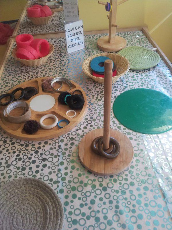 a table topped with lots of different types of crafting supplies on wooden trays