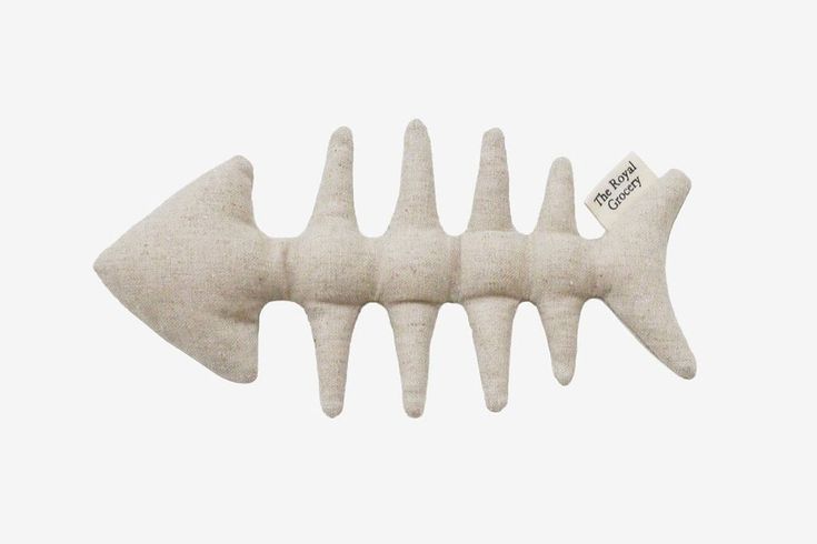 a stuffed fish bone is shown against a white background