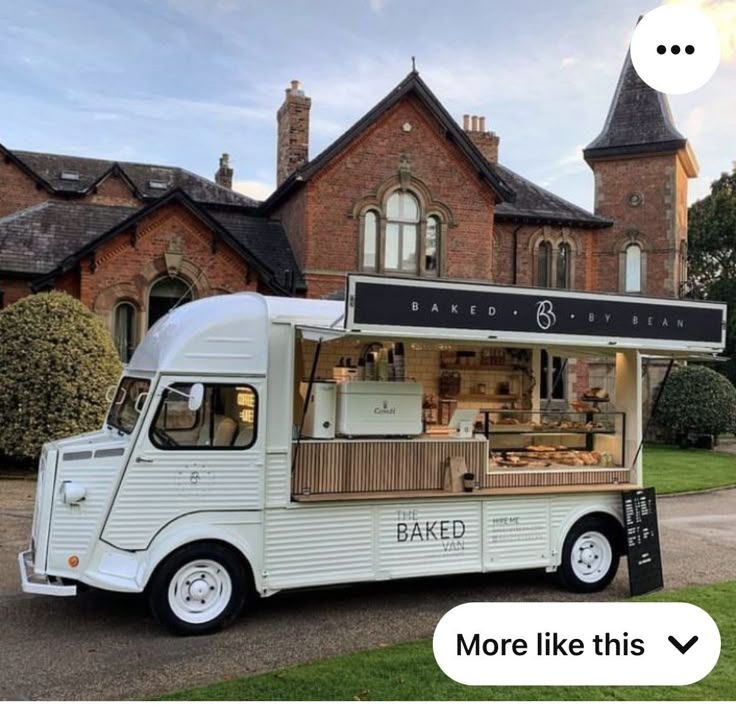 a food truck parked in front of a brick building