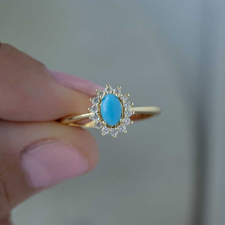 Looking for a stunning turquoise ring? Look no further! The turquoise is set against a cubic zirconia halo where it allows the turquoise to really pop! It's suitable for everyday wear! - - - D E T A I L S - - - * Made of 925 Sterling Silver * THICK plating of 14k Gold or Rhodium * Available in Sizes 4-10 * Made of highest quality lab created turquoise and cubic zirconia * VERY HIGH QUALITY * Nickel-free & Hypoallergenic - will NOT turn fingers green! * Turquoise Stone: 4x6mm Ring Sizer Tool https://samijewels.etsy.com/listing/1240904225 🎁 Comes in a gift-box, ready for gift giving!  ✈️ Ships same day for fast delivery!  ♡ Made with 100% Pure Love!  🥰 Happy to answer any questions you may have!  🤗 Let's Connect!  IG: samijewels_ Turquoise Gemstone Ring, Luxury Vintage Turquoise Ring Gift, Turquoise Diamond Ring, Turquoise Engagement Ring, Gold Ring Stacking, Turquoise Stone Jewelry, Turquoise Statement Ring, Ring Turquoise, Celestial Jewelry