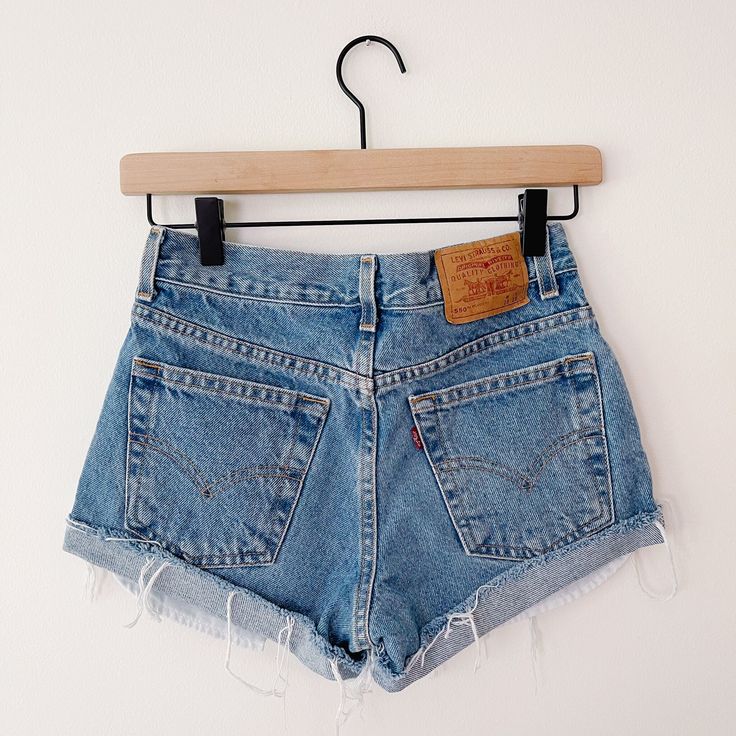 These vintage Levi's shorts are in good condition, perfect for everyday wear this summer. *Brand: Levi's, 550 *Original Tag Size: Husky W28 Measurements: Waist: 27.5 inches, Hips: 35.5 inches, Rise: 8 inches, Inseam: 2.25 Inches. Material: 100% Cotton Vintage Summer Shorts With Belt Loops, Vintage Belt Loop Shorts For Summer, Retro Cutoff Bottoms For Summer, 90s Style Shorts With Pockets For Summer, Summer Retro Cutoff Bottoms, 90s Style Summer Shorts With Pockets, Vintage Summer Shorts With Pockets, Vintage Medium Wash Relaxed Fit Shorts, Vintage Relaxed Fit Jean Shorts With Pockets