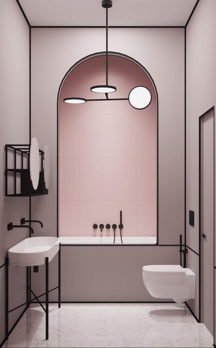 a bathroom with pink walls and white fixtures