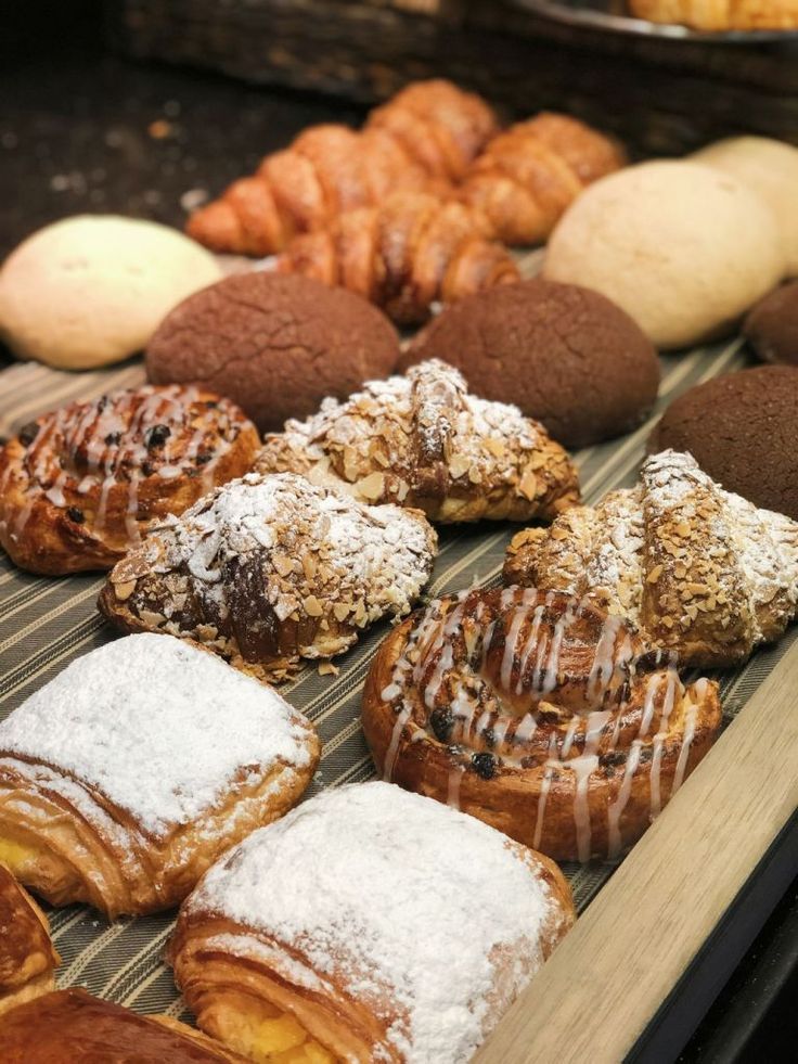 many different types of pastries are on display