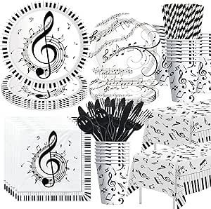 black and white music themed party supplies including paper plates, napkins, and cupcakes