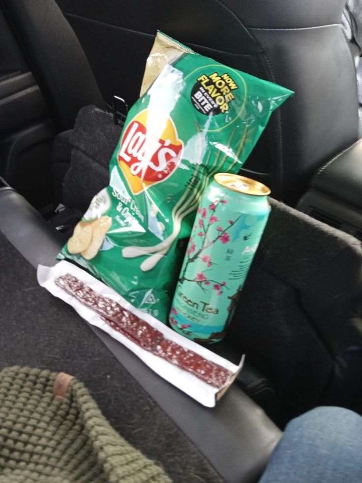 the back seat of a car with some snacks in it