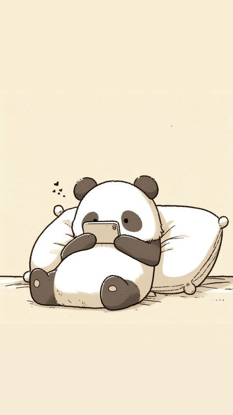 a panda bear sitting on top of a pillow holding a cell phone in its paws