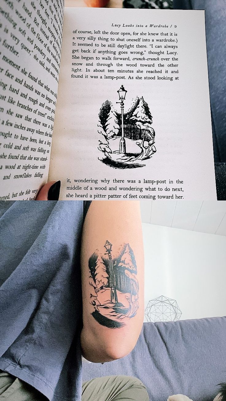 a person with a tattoo on their arm reading a book