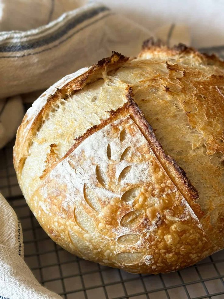 a loaf of bread sitting on top of a cooling rack