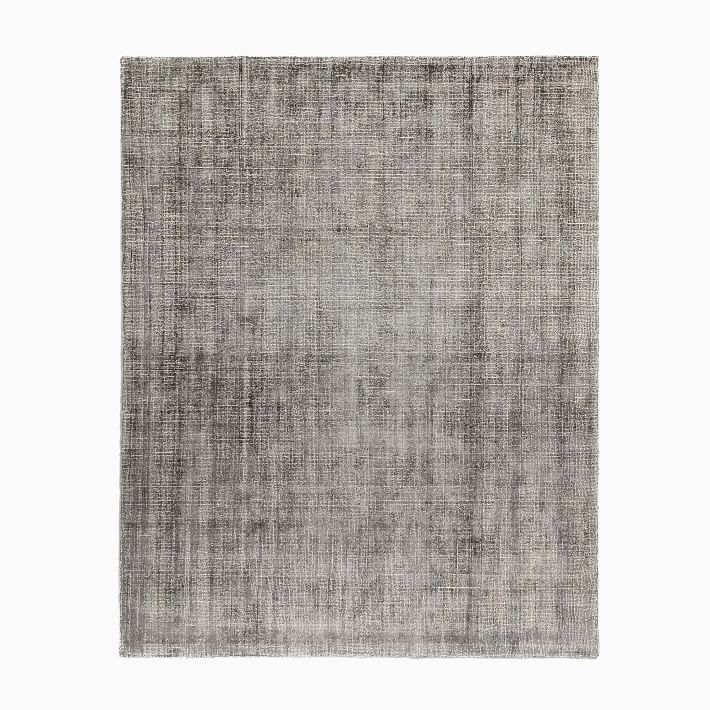 a gray rug on a white background with no one in it or someone out there