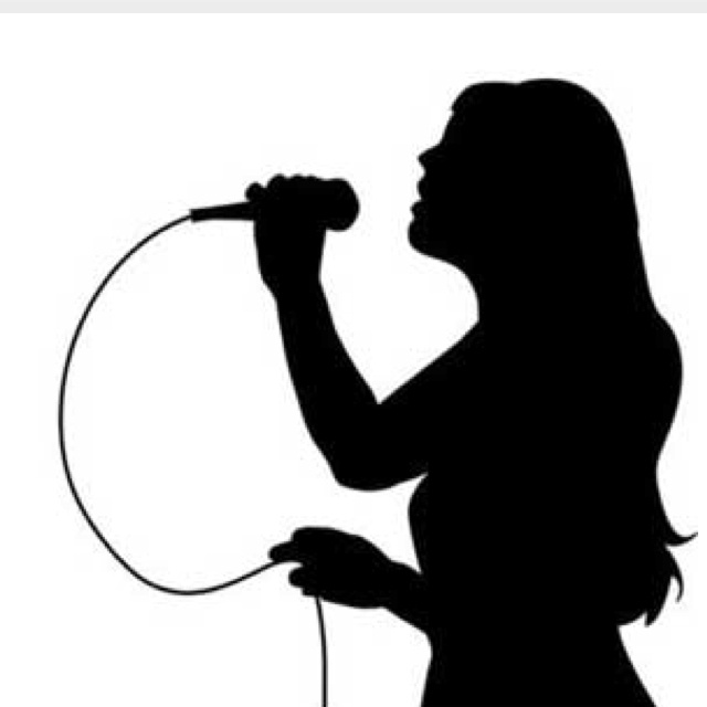 the silhouette of a woman singing into a microphone