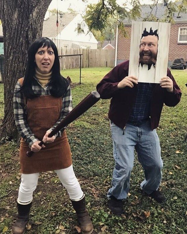 two people dressed up as characters from the animated movie, king and country girl holding an open book