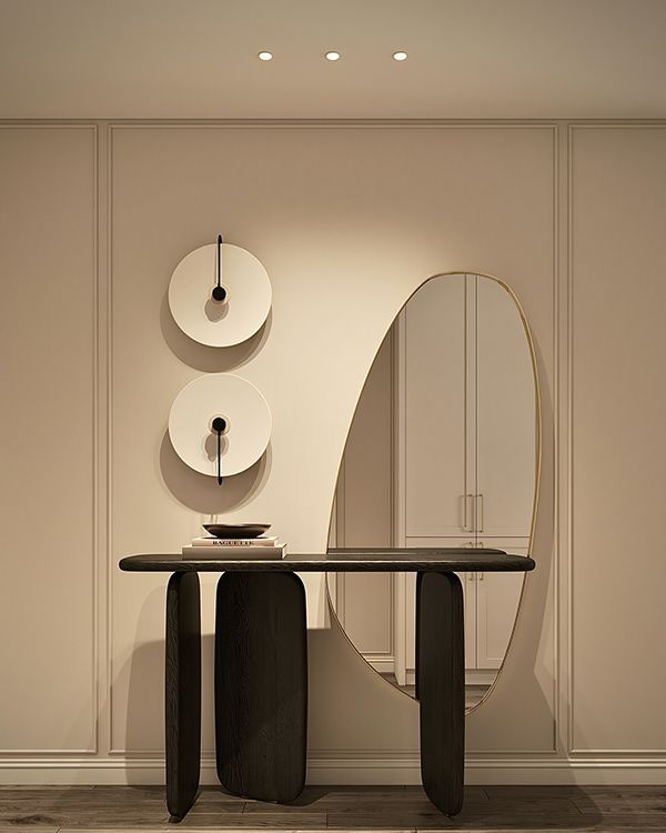 a table with two round mirrors on the wall