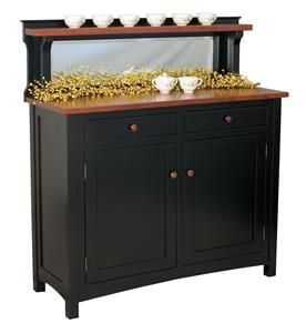 a buffet table with gold decorations on top and two bowls sitting on it's side