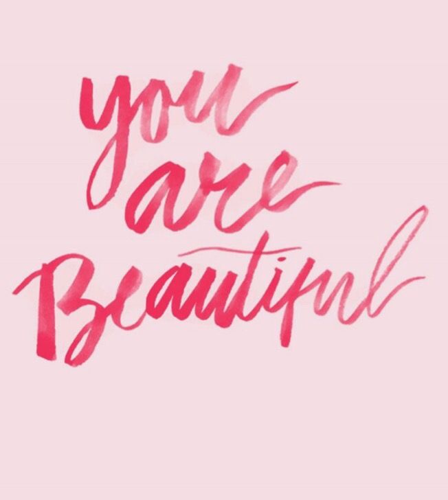 the words you are beautiful written in red ink on a pink background with black writing