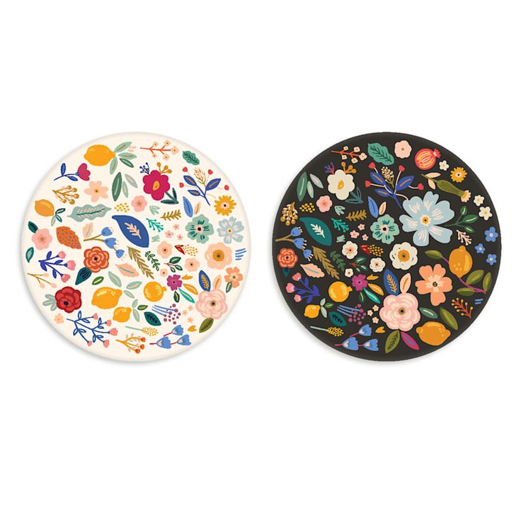 two plates with floral designs on them