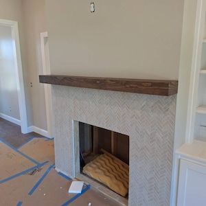 the fireplace is being installed in the living room