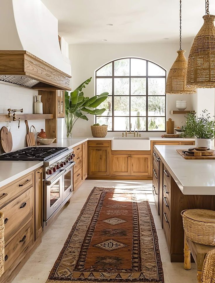 a large kitchen with wooden cabinets and white counter tops, along with an area rug on the floor