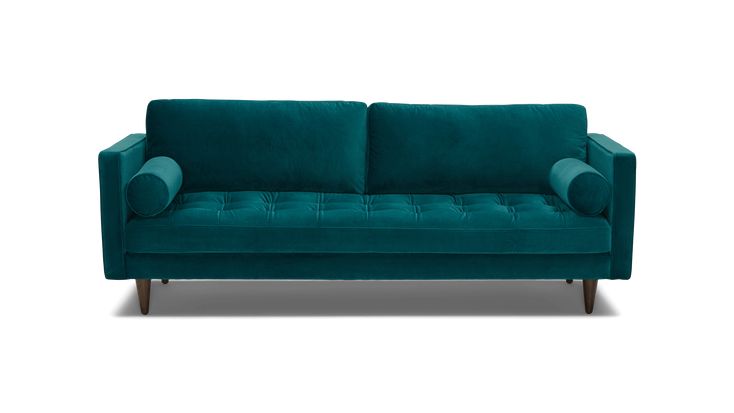 a teal colored couch with wooden legs and arms on an isolated white background,