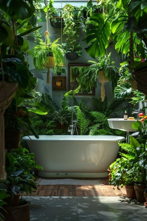 a bathtub surrounded by lots of green plants in a room filled with potted plants