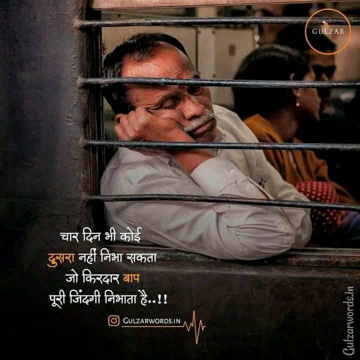 a man sitting behind bars with his head in his hands