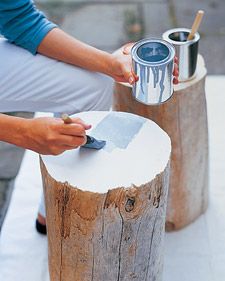 a person is painting a piece of wood with blue paint on the top and bottom