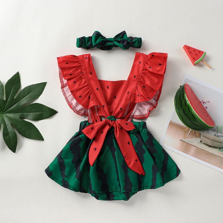 Dress your little one in the refreshing and adorable style of our Watermelon Ruffle Sleeve Baby Jumpsuit. This charming jumpsuit is perfect for the sunny days of spring and summer, adding a delightful touch to your baby's wardrobe. The jumpsuit features a vibrant watermelon print, capturing the essence of summer fun and adding a pop of color to your baby's outfit. The ruffled sleeves add a playful and feminine touch, creating a cute and fashionable look. Designed with convenience in mind, the ju Watermelon Dress, Adorable Style, Watermelon Print, Baby Jumpsuit, Cute Rompers, Matching Headband, Sleeveless Rompers, Jumpsuit With Sleeves