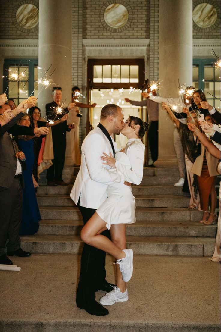 Wedding sparkler photos, wedding sparklers, wedding send off, wedding send off photos, bridal sneakers, bridal tennis shoes, Reception dress, wedding dress, wedding, bride, unique reception dress, reception dress idea, reception dress inspo, modern wedding, classic wedding, engagement photo dress, engagement photos, house of cb dress, engagement photo outfit, engagement photo ideas Wedding Send Off Dress Short, Wedding Dress Change Receptions, Second Wedding Dress For Dancing, Reception Dress Sneakers, Wedding After Party Sneakers, Reception Sneakers, Reception Dress And Sneakers, Send Off Dress, Wedding Dress Change For Reception Short