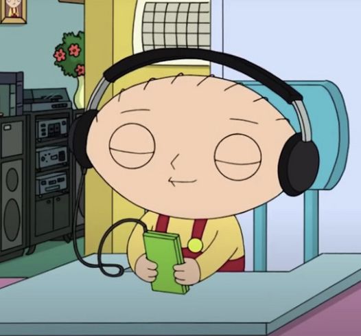 a cartoon character wearing headphones and holding a book in front of a television set