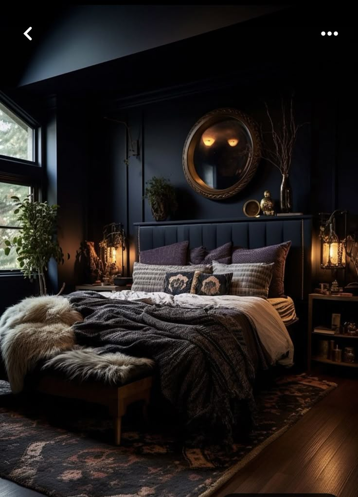 a bedroom with black walls and wooden floors