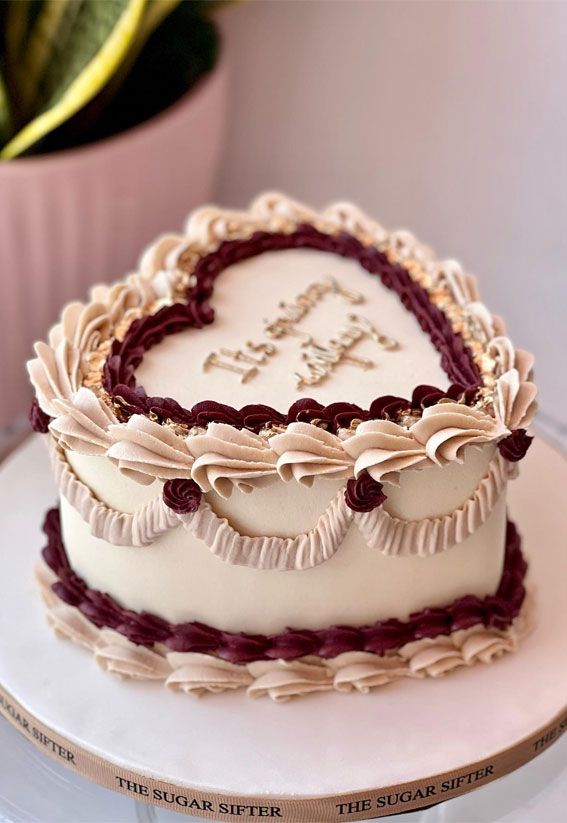 a heart shaped cake sitting on top of a white plate