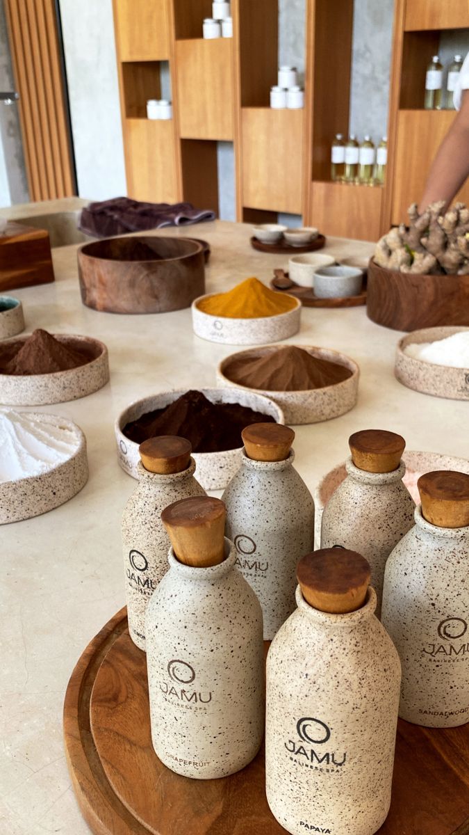 there are many bottles on the table with spices in them