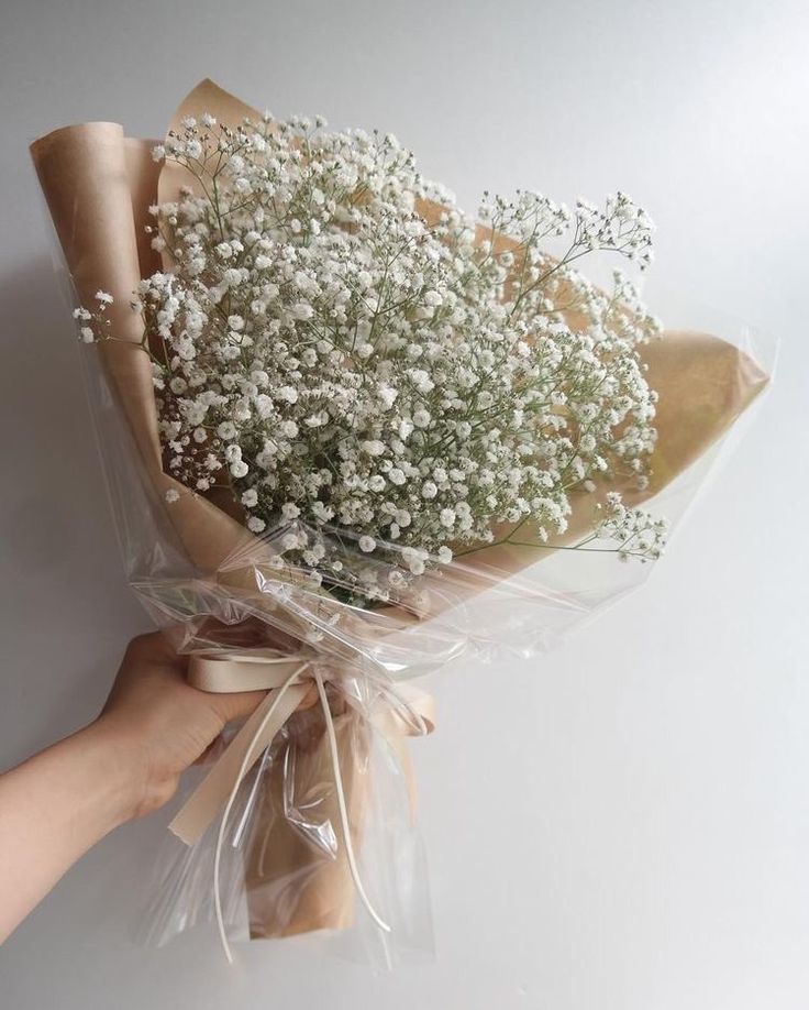 a bouquet of baby's breath wrapped in plastic