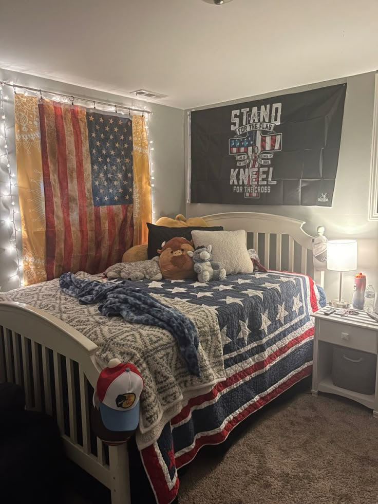 a bedroom with an american flag quilt on the bed