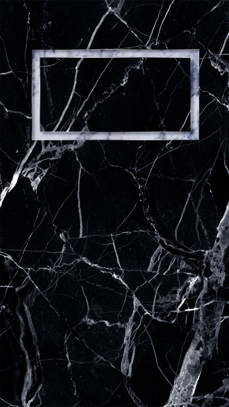 a black marble wall with a white frame