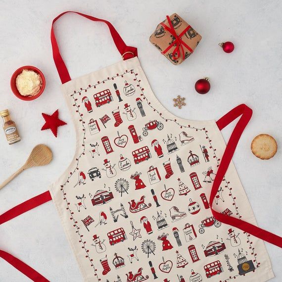 the apron is decorated with red ribbon and other things to decorate on it's side