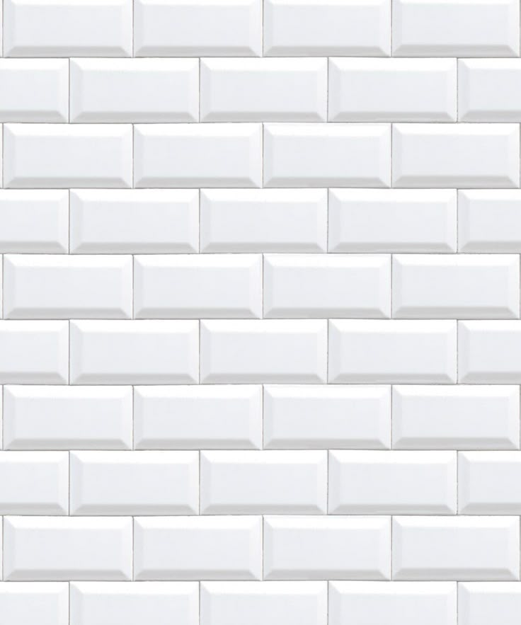 a white brick wall that is made out of tiles