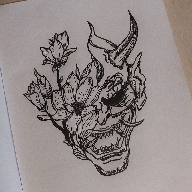 a drawing of a skull with flowers in it's mouth and horns on its head