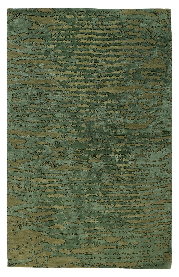 an area rug with green and brown colors